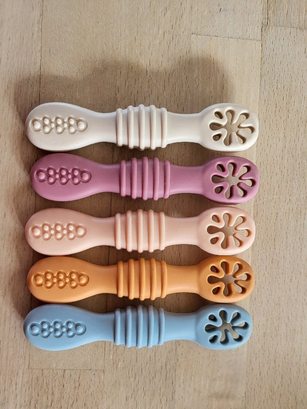 Silicone baby self feeding spoons.  Teething chews.